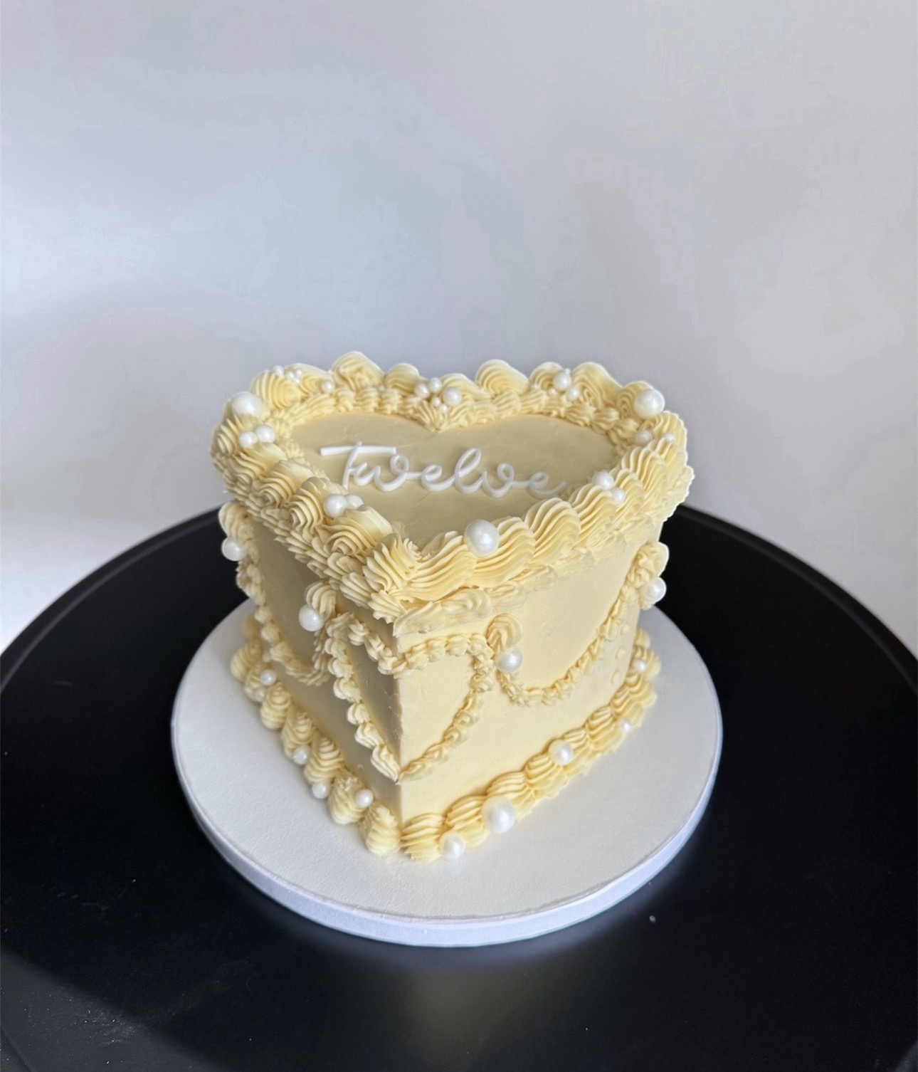 Vintage heart shaped buttercream cake with pearls